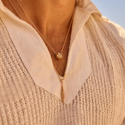 Layered 18k rose gold ring pendant with cognac diamonds and 18k yellow gold sword pendant with cognac diamonds