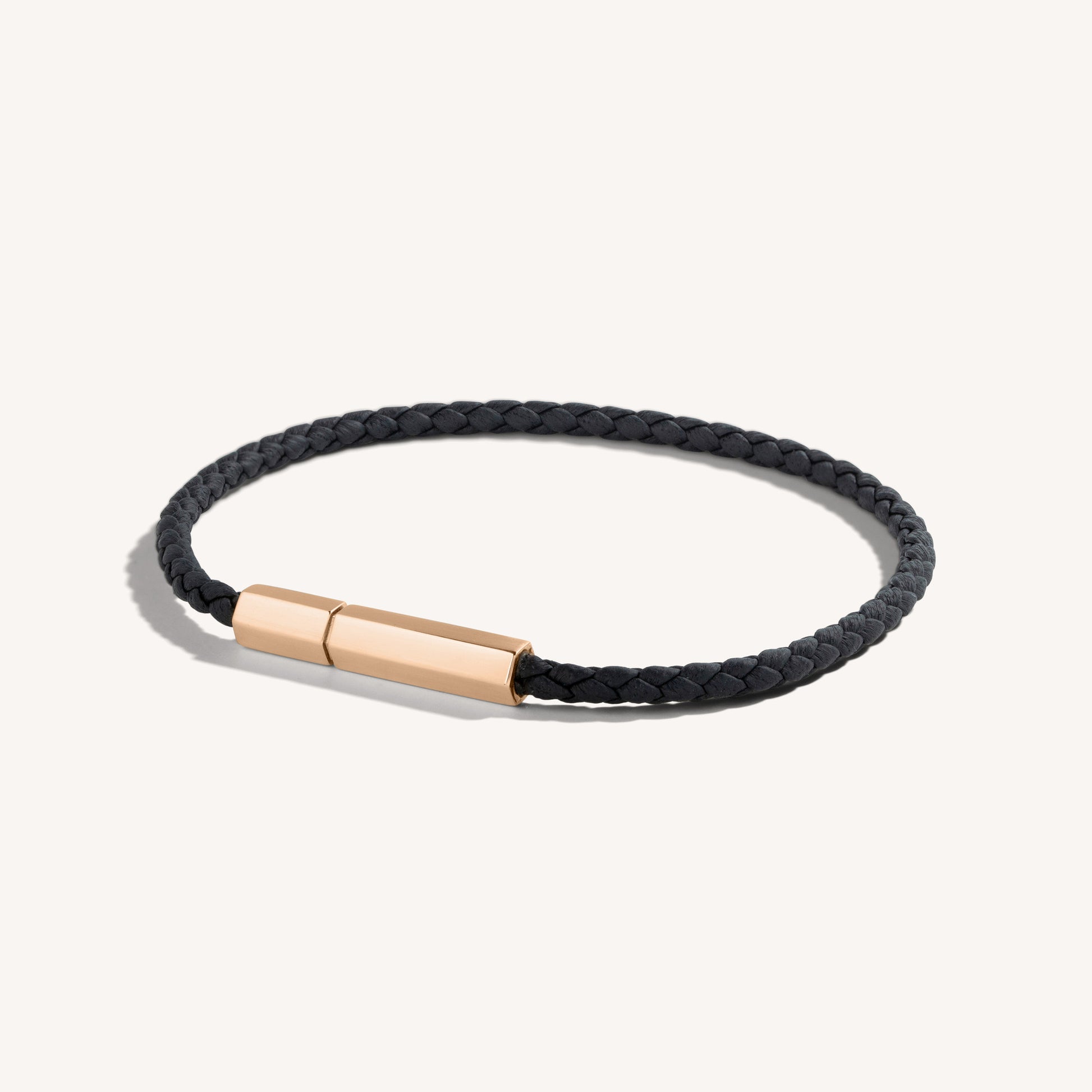 Wrapped hexagonal black Nappa leather bracelet with 18k rose-gold magnetic clasp.
