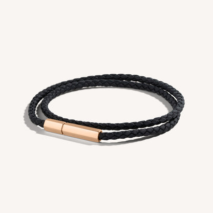 A black wrapped hexagonal leather bracelet with a 18k rose gold magnetic closure.